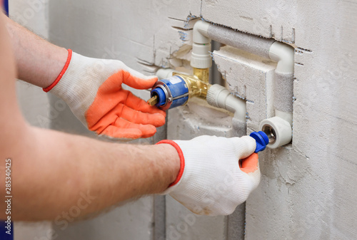 Installing a plug on the built-in faucet.