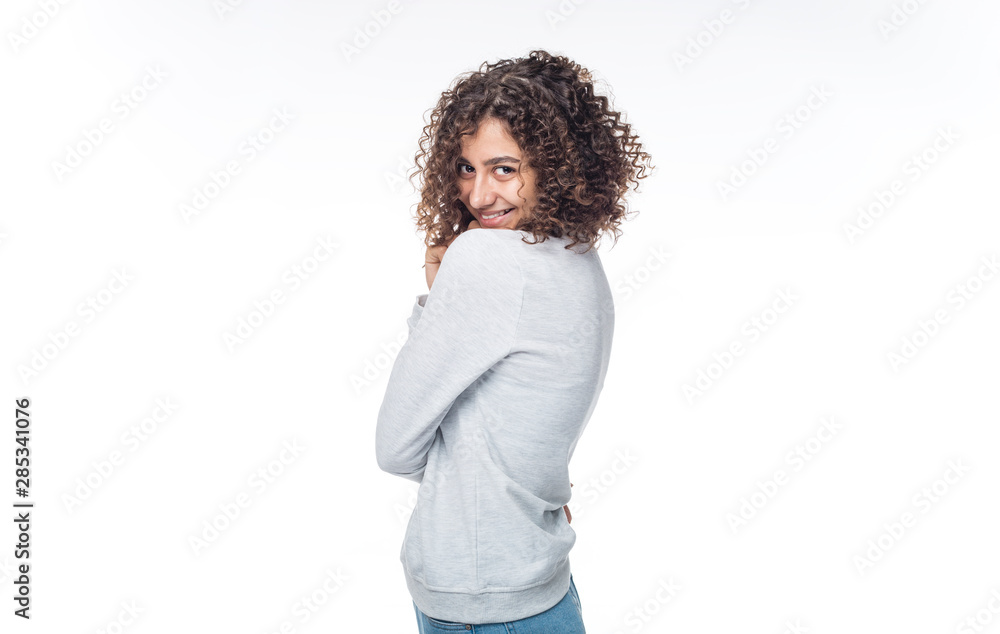 Portrait of a smiling Indian girl. Happy young mixed race woman on a white isolated background.  