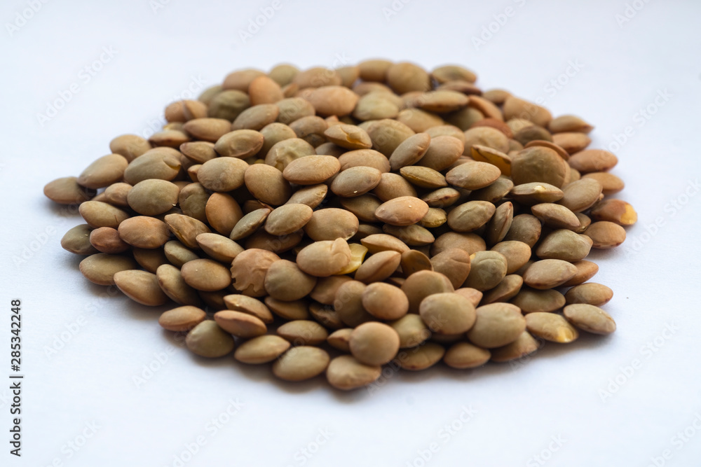 macro of lentils on a white background macro of lentils on a white background
