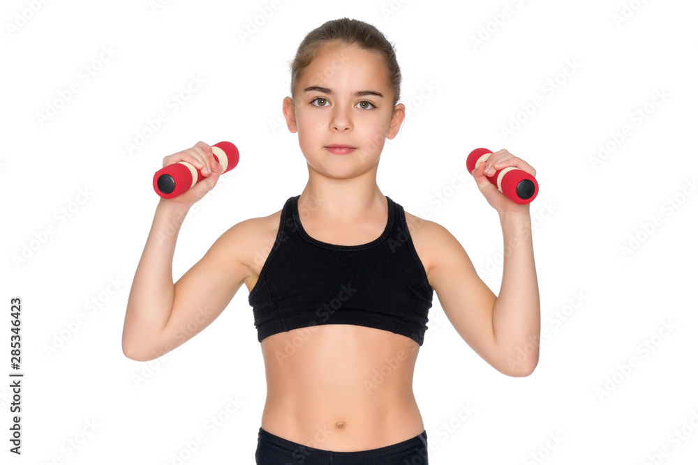 Little girl doing exercises with dumbbells. Little girl doing exercises with dumbbells.