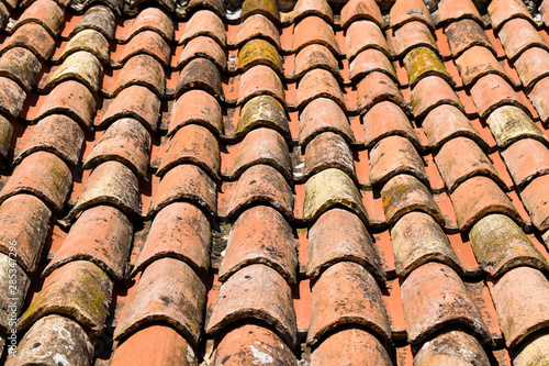Close up shot of old orange roof with clay tiles