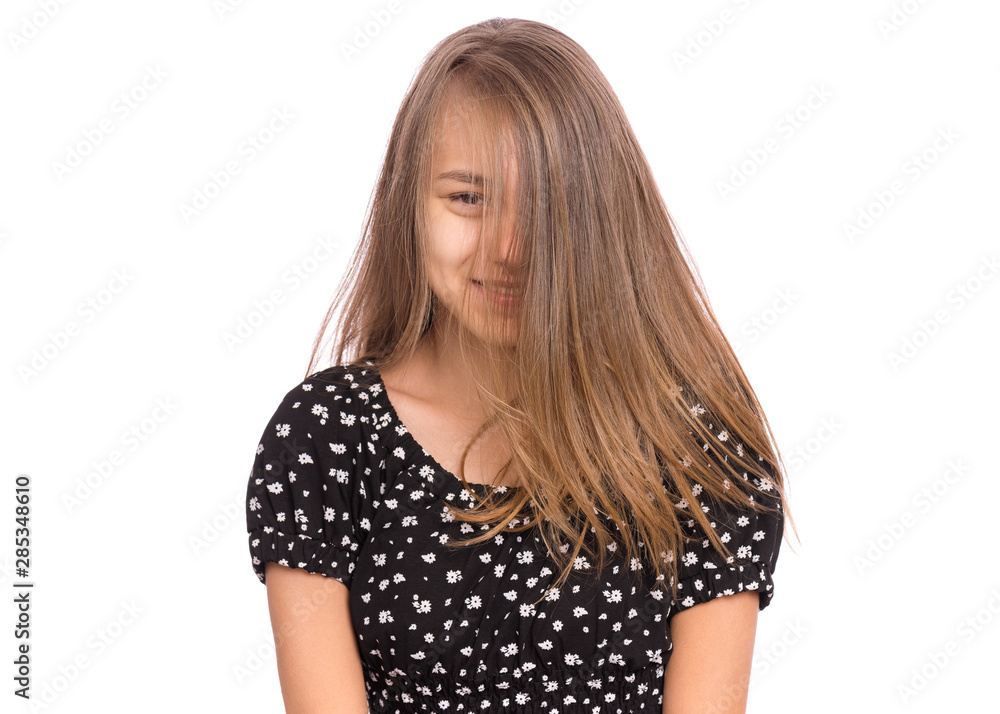 Beautiful teen girl smiling looking at camera. Happy child with shy expression on face, close up portrait. Cute female student with long hair, isolated on white background. Beautiful teen girl smiling looking at camera. Happy child with shy expression on face, close up portrait. Cute female student with long hair, isolated on white background.