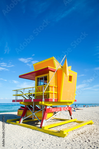 Bright sunny view of colorful lifeguard hut on a calm afternoon in South Beach, Miami, Florida, USA © lazyllama
