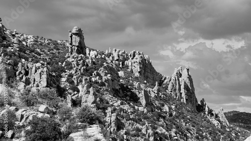 Dramatic rocks on a ridge overlooking the Catalina Highway or Mount Lemmon Highway en route to Mt. Lemmon in the Santa Catalina Mountains above Tucson, Arizona. Black and white high contrast photo.