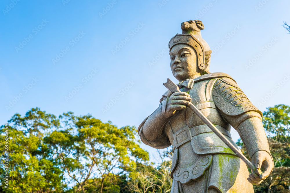 Fototapeta premium Statue of the General Anila, The Twelve Divine Generals. Represents 1pm-3pm of the day and Sheep of the Chinese 12 Zodiac, and is armed with a arrow. Located in Lantau Island, Hong Kong.