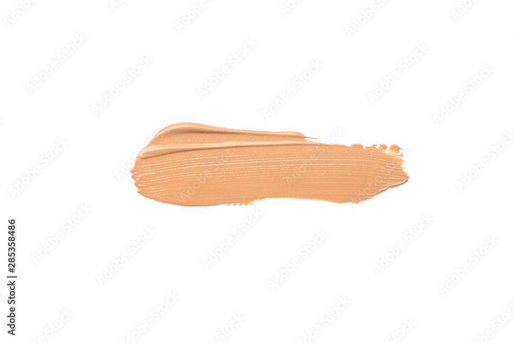Bright beige smear of foundation in the form of a group of horizontal strokes isolated on a white background. Bright beige smear of foundation in the form of a group of horizontal strokes isolated on a white background.