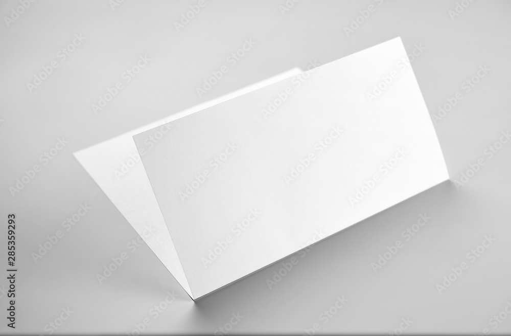Blank folded letterhead over gray background Blank folded letterhead over gray background