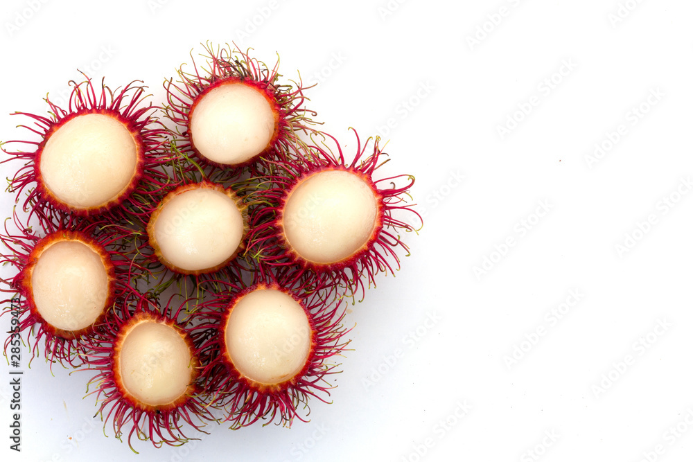 Fresh Rambutan with green leaves isolated on white background Fresh Rambutan with green leaves isolated on white background