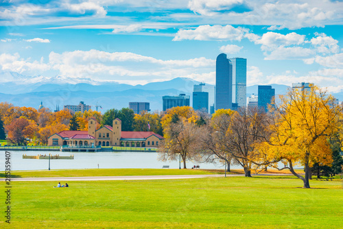 Scenic of Denver Colorado skyline. City Park, Ferril Lake and Rocky Mountains. Located in Denver, Colorado, USA.