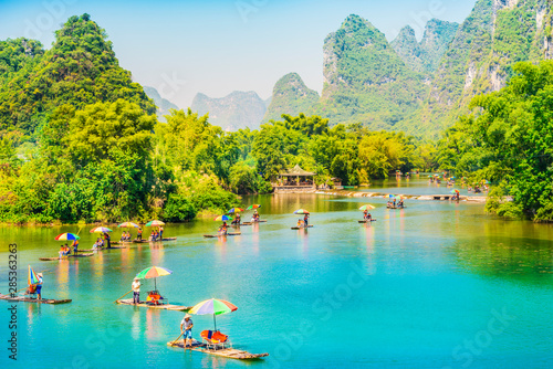 Landscape of Guilin. Tourists are visiting by Bamboo raft. Located in Yangshuo, Guilin, Guangxi, China.