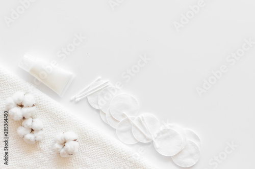 Hygiene cotton swabs, pads and cream for pattern on white background top view mock up
