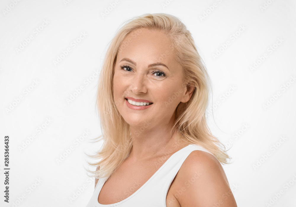 Portrait of beautiful mature woman with perfect skin on white background Portrait of beautiful mature woman with perfect skin on white background