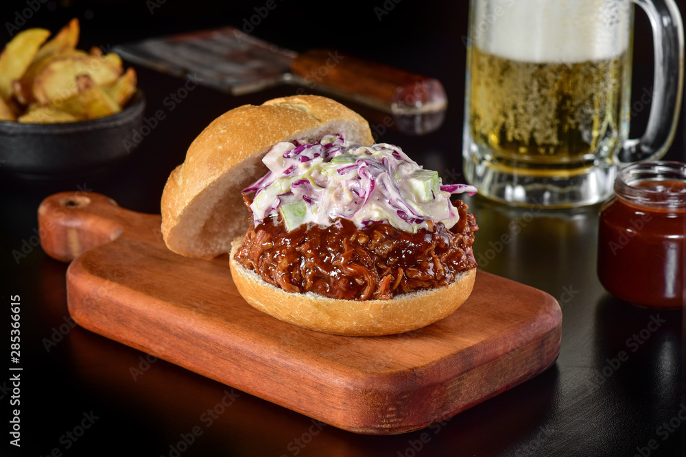 Pulled pork sandwich on rustic decorated scene Pulled pork sandwich on rustic decorated scene