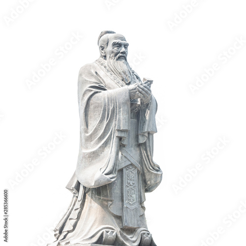 Confucius statue isolated on white background. Located in Jianshui Confucius Temple, Jianshui, Yunnan, China. photo
