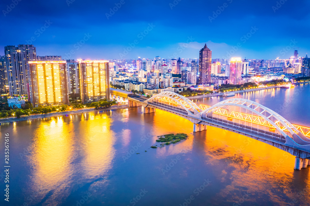 Fototapeta premium Cityscape of Harbin. Harbin Songhua River Railway Bridge. Located in Harbin, Heilongjiang, China.