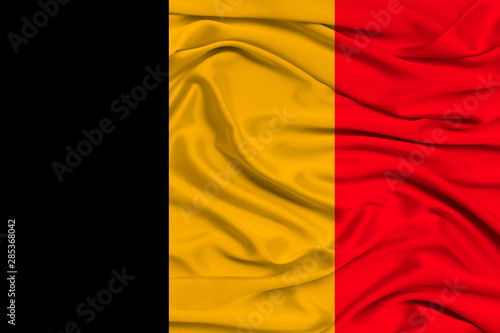 Fotografie national flag of belgium on gentle silk with wind folds, travel concept, immigra