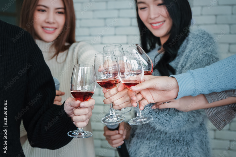 group of asian friends enjoy having party and drinking wine together group of asian friends enjoy having party and drinking wine together
