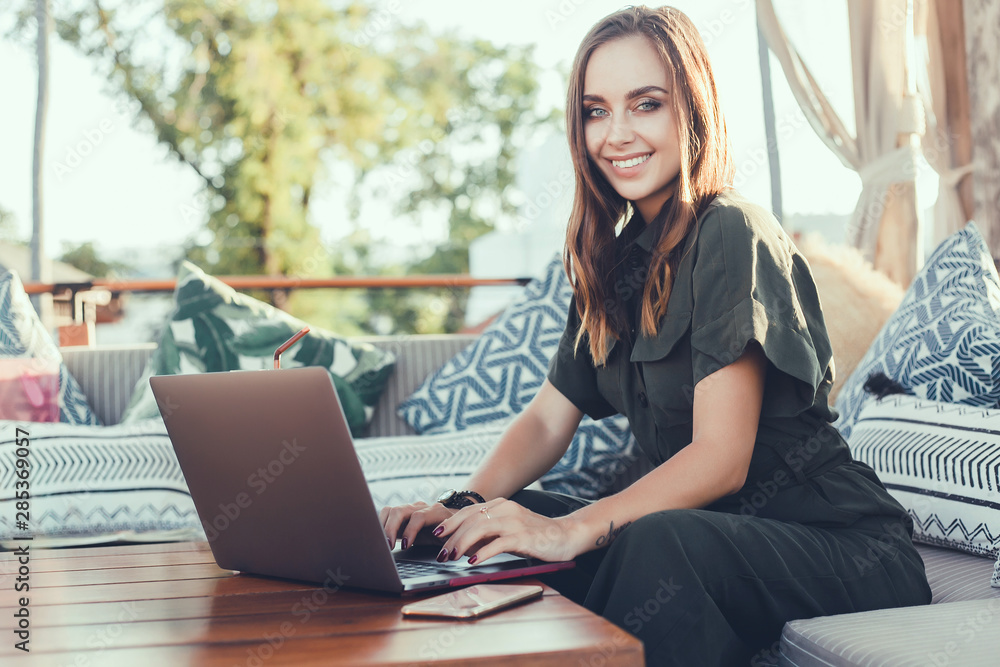 Pretty Young Beauty Woman Using Laptop in cafe, outdoor portrait business woman, hipster style, internet, smartphone, office, Bali Indonesia, holding, mac OS, manager, freelancer Pretty Young Beauty Woman Using Laptop in cafe, outdoor portrait business woman, hipster style, internet, smartphone, office, Bali Indonesia, holding, mac OS, manager, freelancer