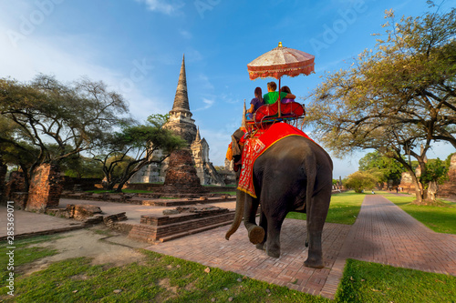 Foreign tourists Elephant ride to visit Ayutthaya, There are ruins and temple in the Ayutthaya period.Concept is Travel in temple phar sri sanphet. © Suppasit