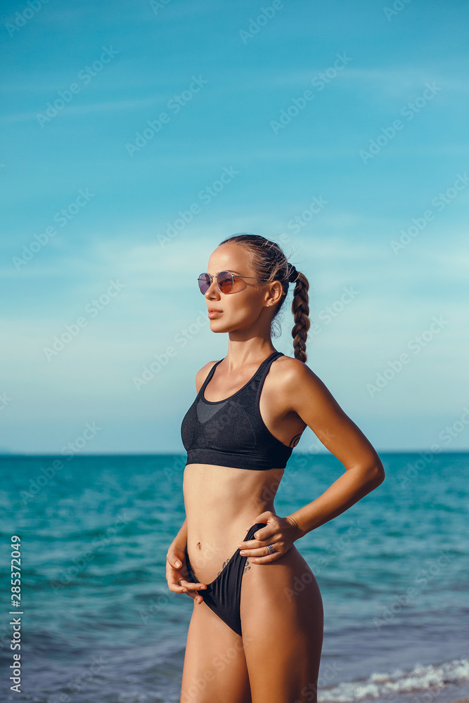 Beauty woman posing in the beach, wall. outdoor portrait, red swim wear, hair blonde, cute, fashion portrait, Thailand, tanning, sun, palms