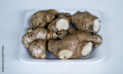 Ginger or Zingiber officinale on white background. Used as a spice and a folk medicine.