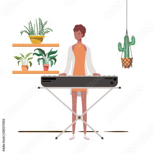 woman with piano keyboard and houseplants on macrame hangers of background