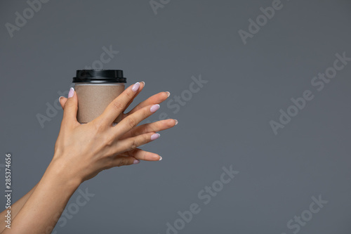 Take Away White Paper Hot Coffee Cup With Right Hand Holding.