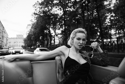 Photography Beauty woman posing with red car in the street,fashion model,outdoor crazy portr