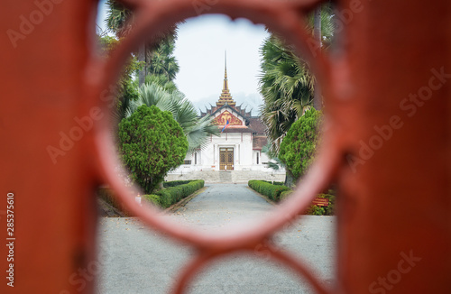 The royal palace of Luang Prabang view look through the gate. The Royal Palace was built in 1904 for King Sisavang Vong and his family.  photo