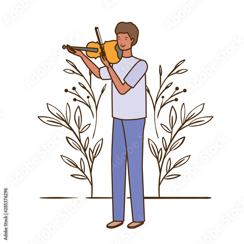 man with fiddle and branches and leaves in the background photo