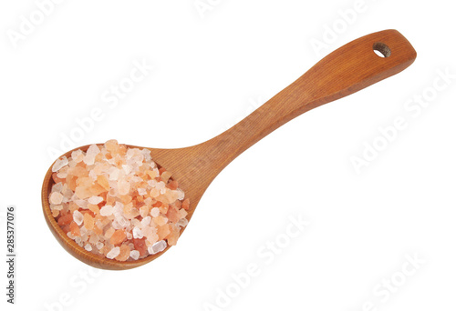 Pink rock salt in wooden spoon isolated on white
