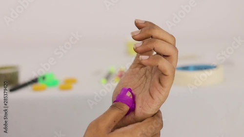 Closeup of Hands doing Massage with Sujok Massager. photo