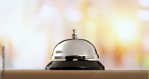 Hotel ring on wooden table background.