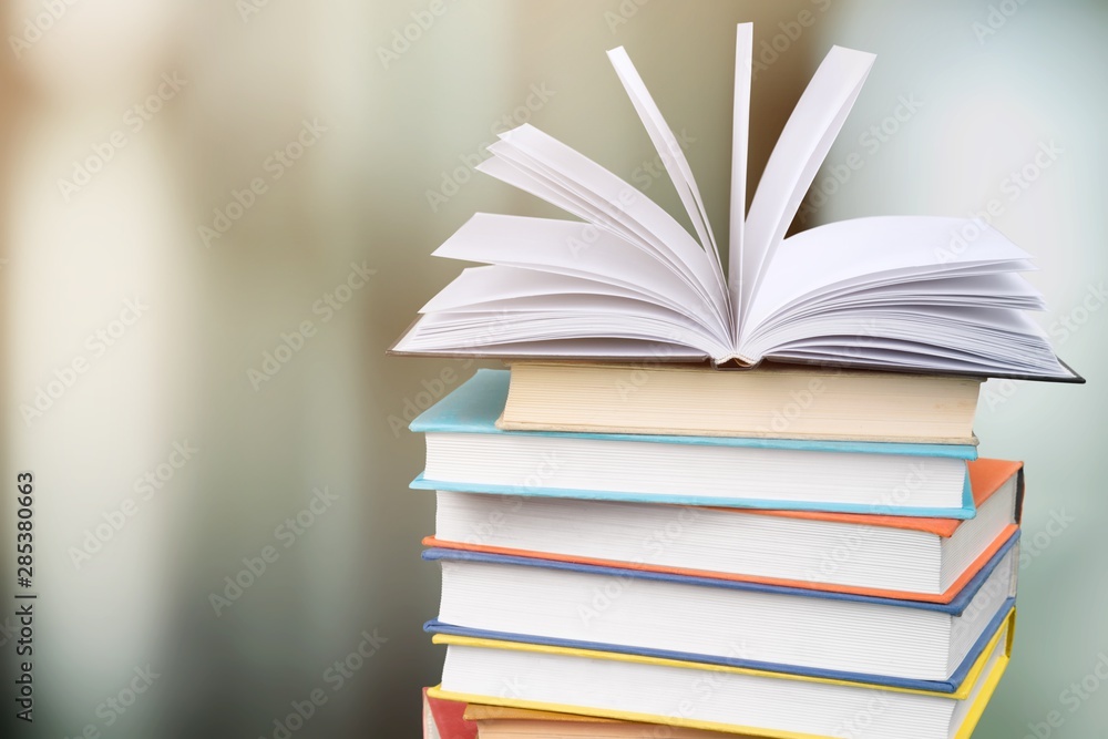 Collection of old books stack on blurred background Collection of old books stack on blurred background