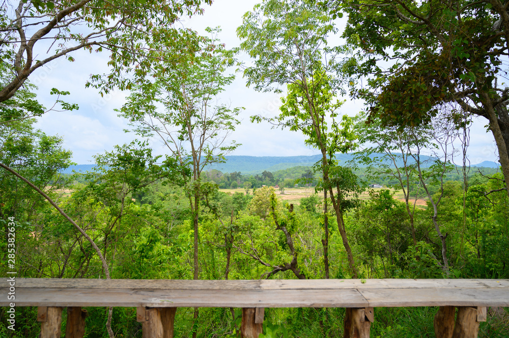 Seat bench in the forest with a view over the mountain. Seat bench in the forest with a view over the mountain.