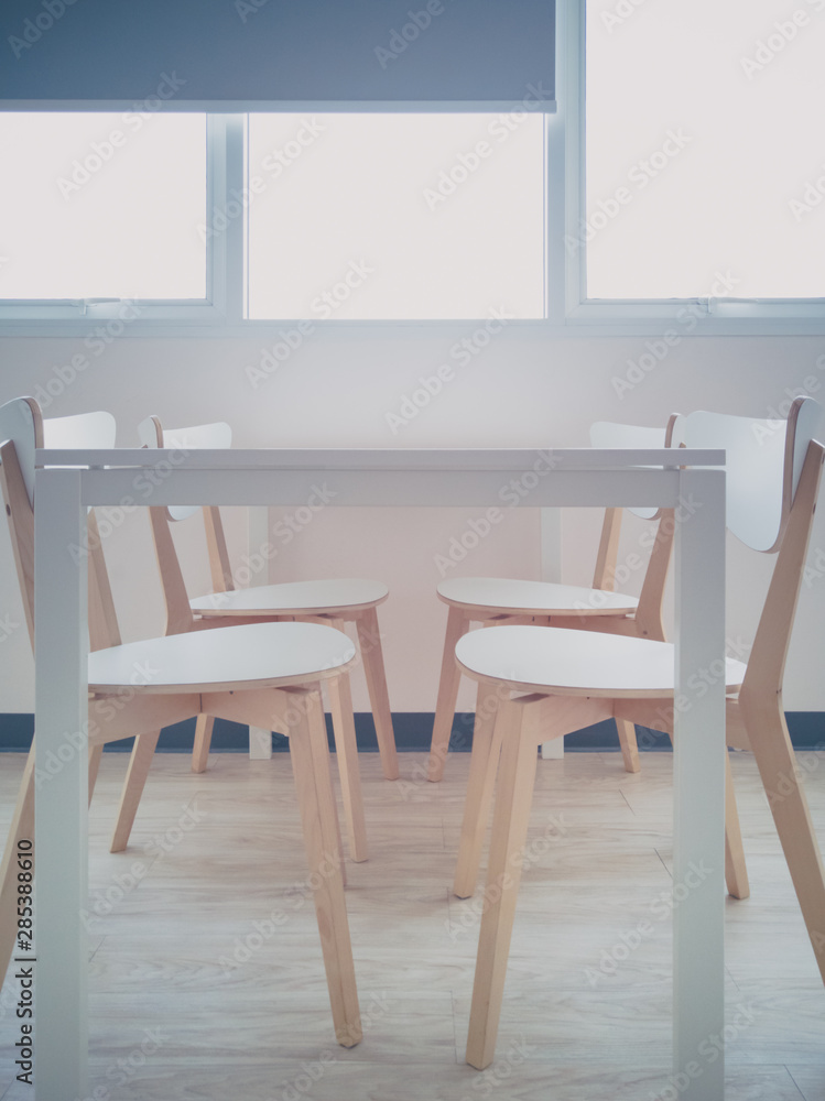 Fototapeta premium Dining table with chairs near window curtains, Top copy space