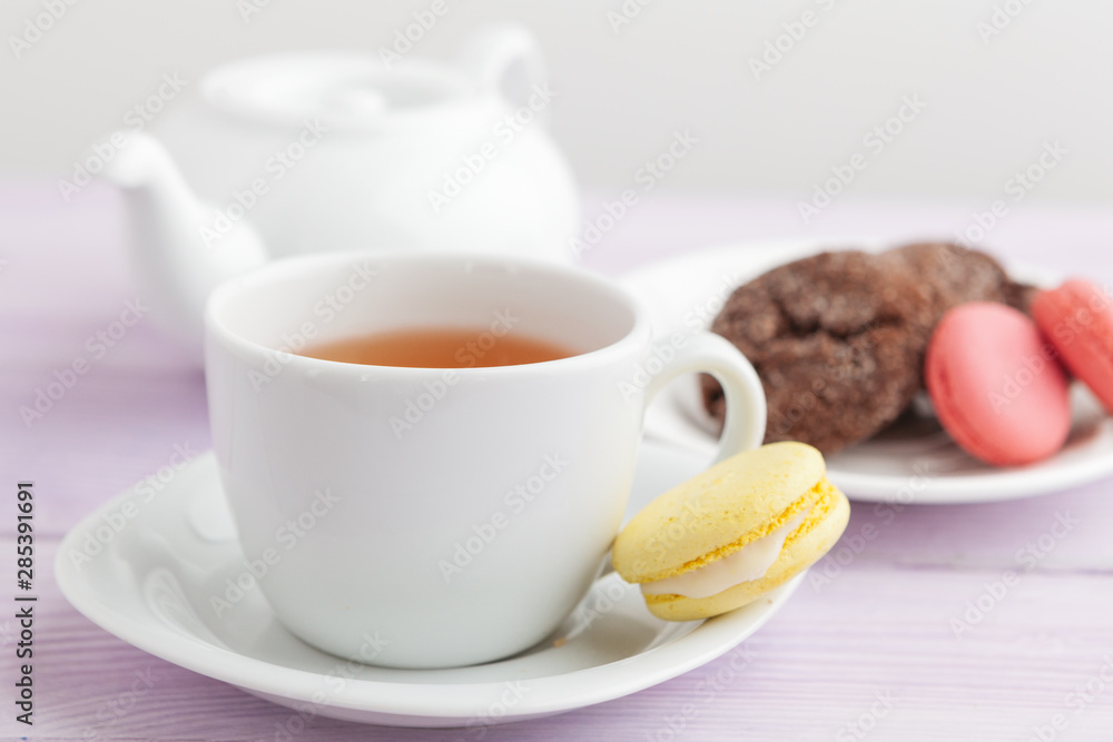 Homemade crunchy cookies and tea on a wooden table Homemade crunchy cookies and tea on a wooden table
