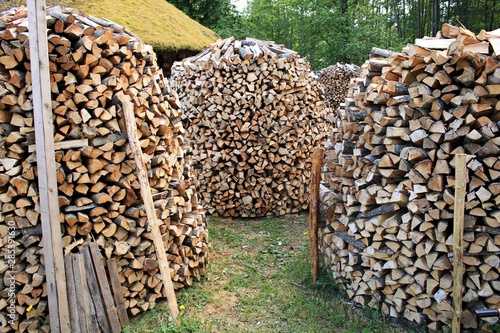 lumbered chopped firewood for the winter and piled in large packs. Melnsils, Kempings, Latvia 06 June 2019