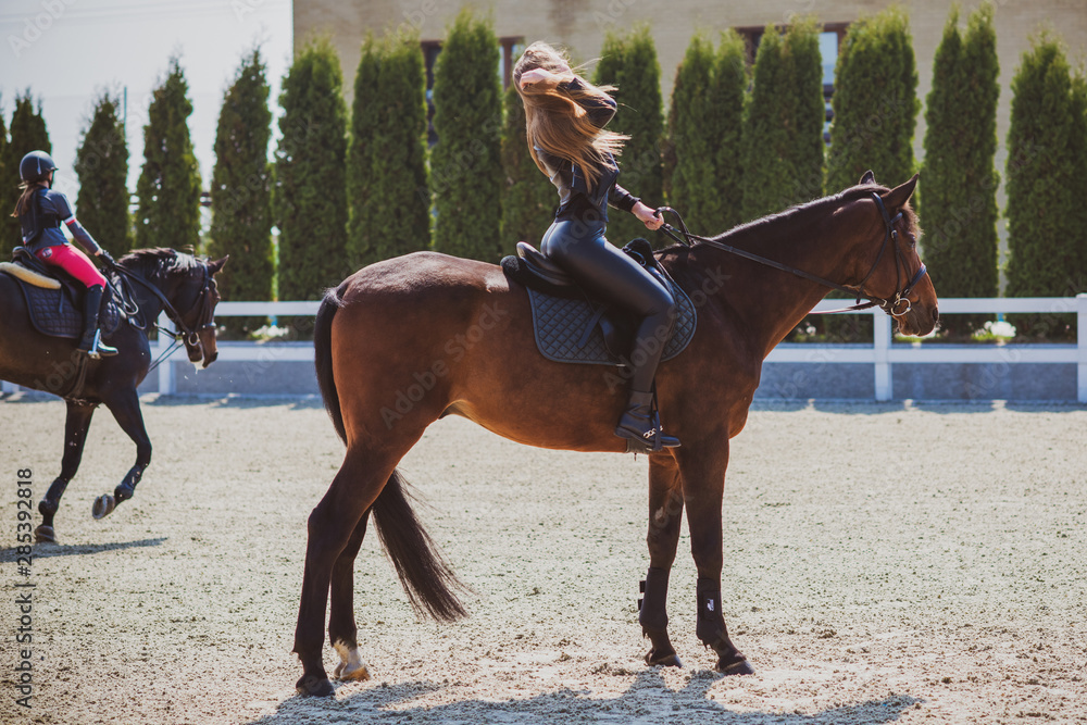 Woman with a horses on farm, pets animals in village on a rancho. Horses are human friends Woman with a horses on farm, pets animals in village on a rancho. Horses are human friends