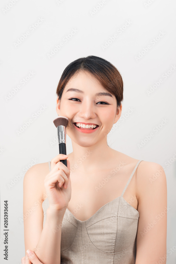 Beauty brunette girl having fun and joking with make up and face powder. Beauty brunette girl having fun and joking with make up and face powder.