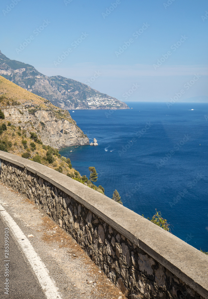 A winding and narrow road on the Amalfi Coast between Positano and Amalfi. Campania, Italy