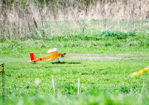 orange model aircraft preparing for takeoff