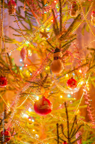 Christmas toys, decorations, garlands in the New year on Christmas trees
