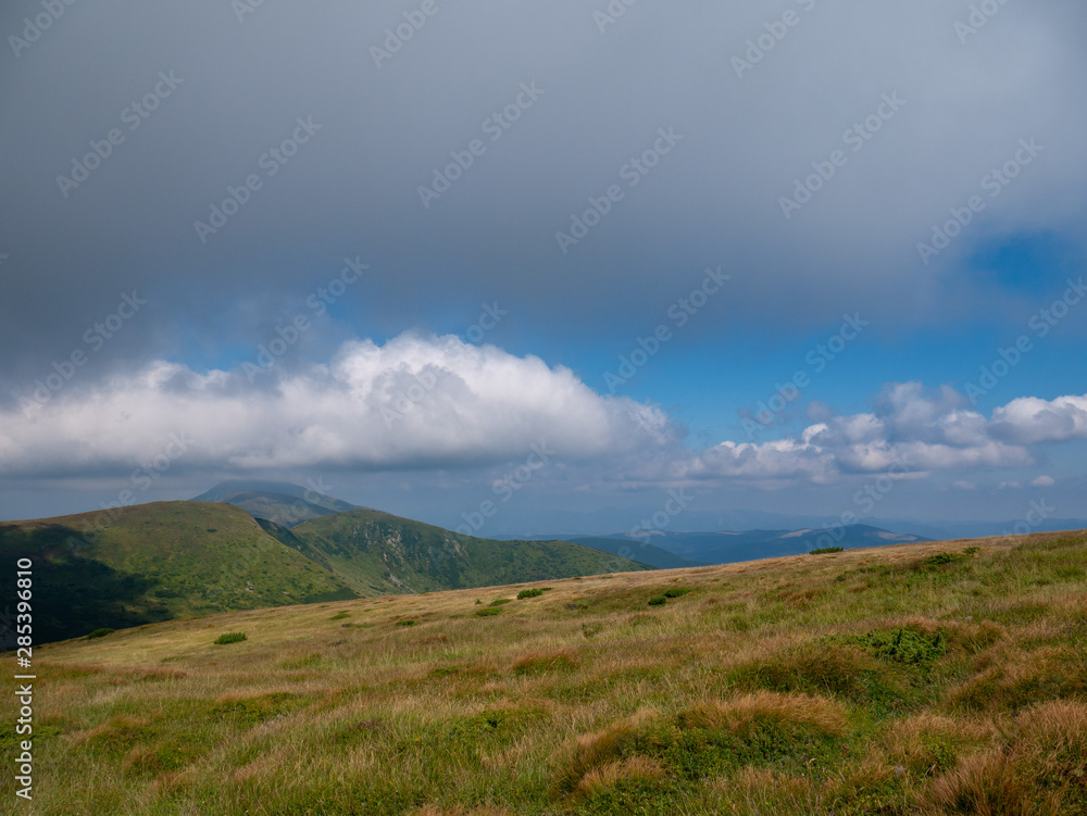 Mountain valley during sunrise / sunset. Natural summer landscape. Colorful summer landscape in the Carpathian mountains.