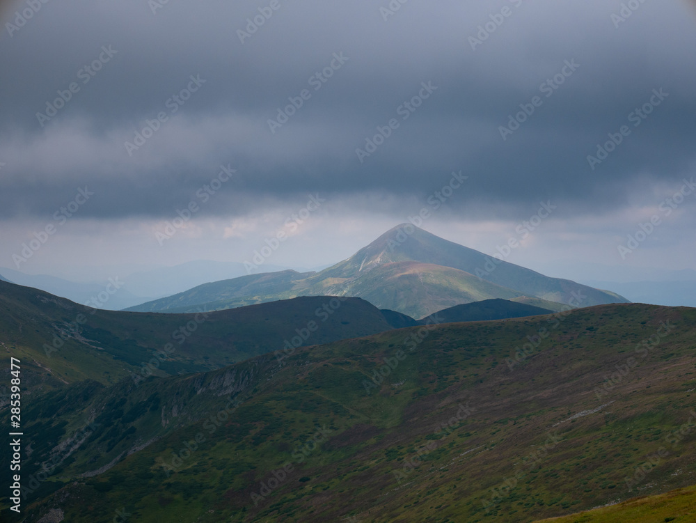 Mountain valley during sunrise / sunset. Natural summer landscape. Colorful summer landscape in the Carpathian mountains.