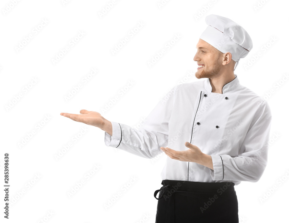 Handsome male chef showing something on white background Handsome male chef showing something on white background