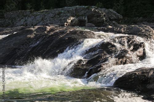 Fast flowing river water of the waterfall Rjukandefossen in Hemsedal, Buskerud, Norway. photo
