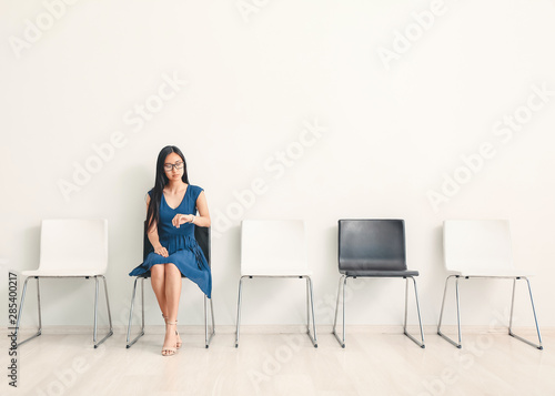 Asian woman waiting for job...