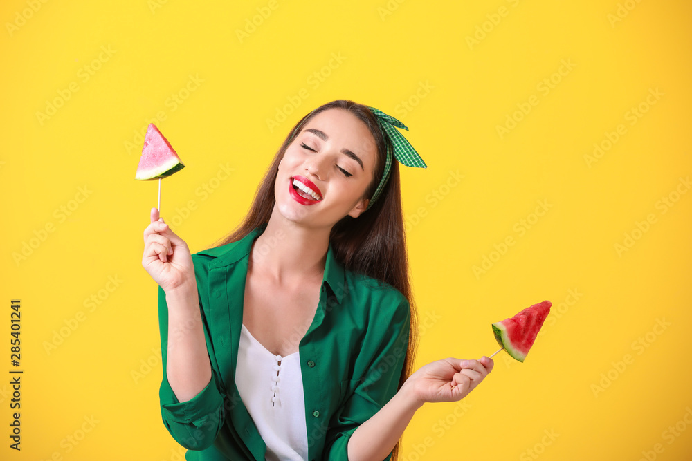 Beautiful young woman with slices of fresh watermelon on color background Beautiful young woman with slices of fresh watermelon on color background