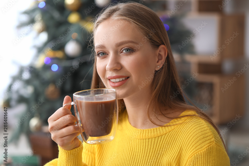 Beautiful woman drinking hot chocolate at home Beautiful woman drinking hot chocolate at home